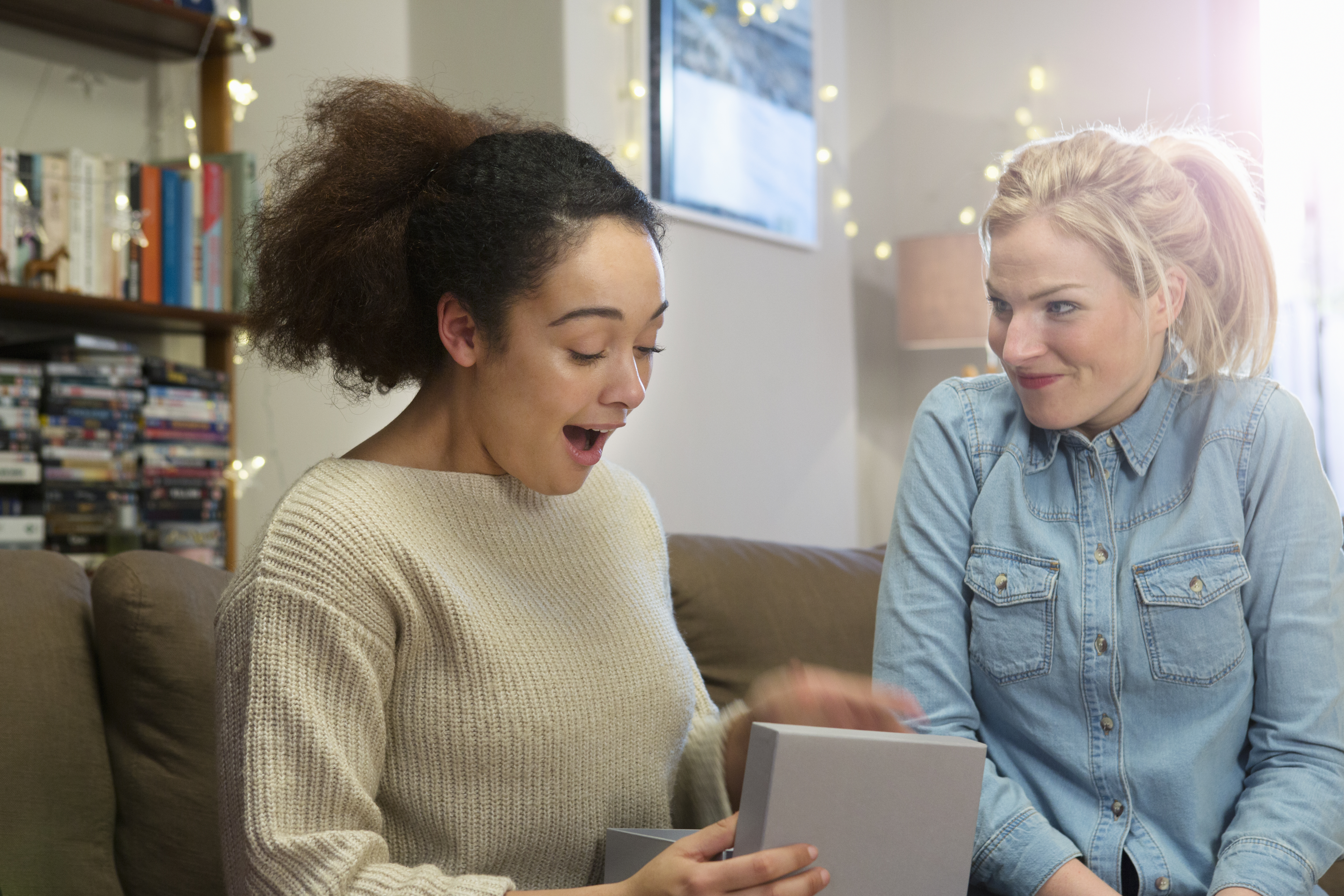 woman opens gift