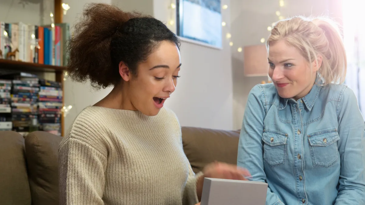 woman opens gift