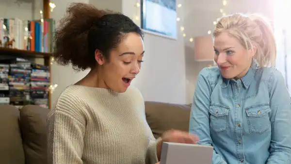 woman opens gift