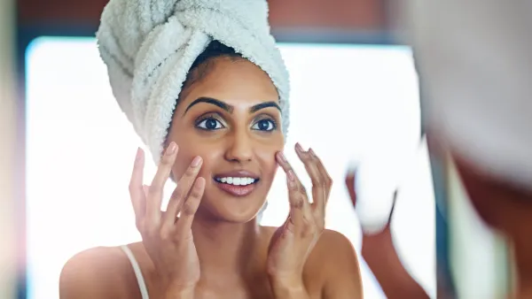 woman applying serum