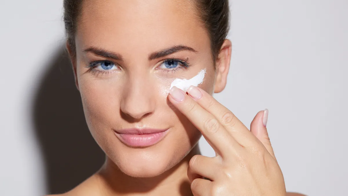 woman applying face cream