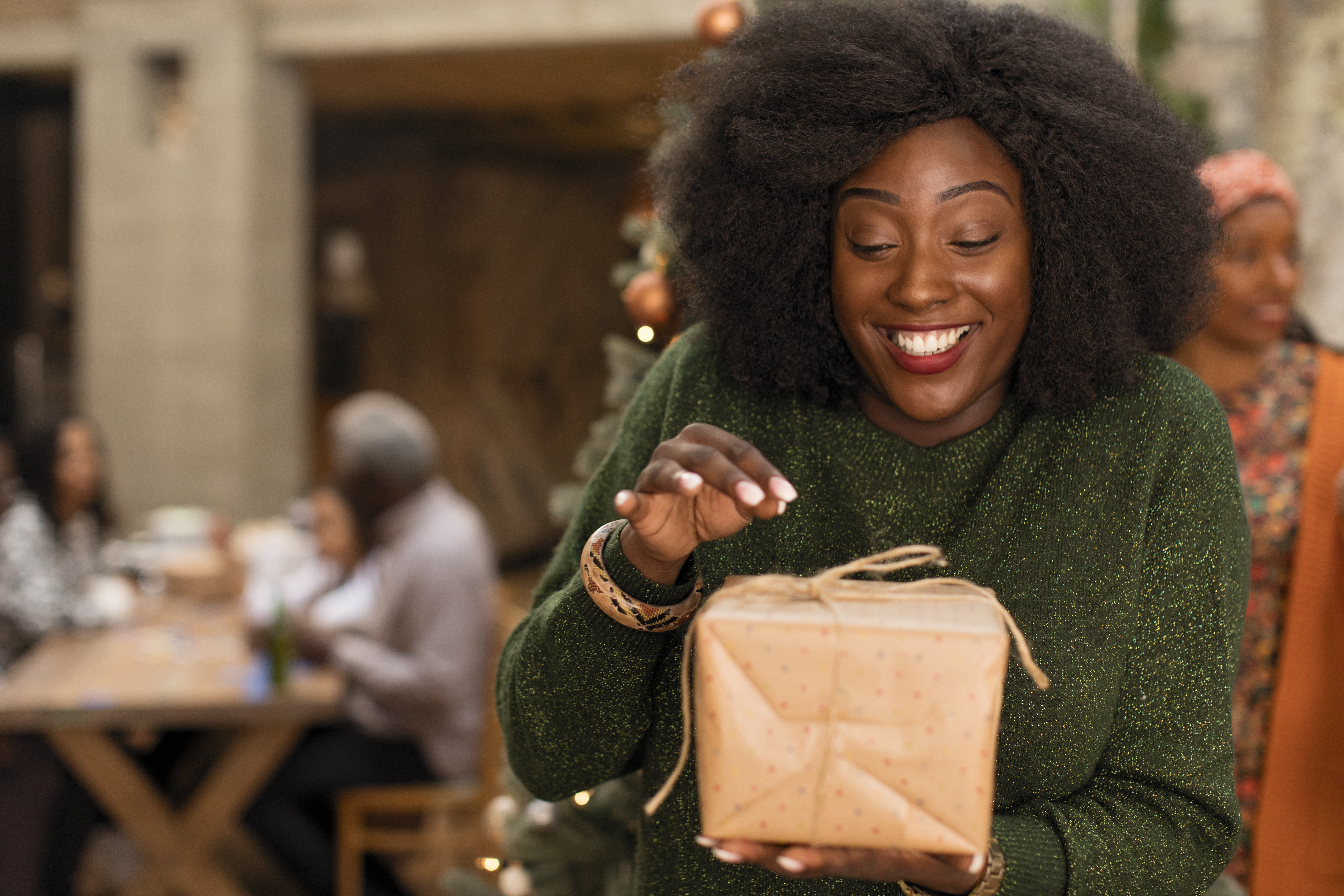 woman opening gifts