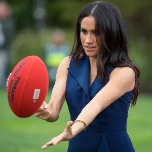Pregnant Meghan Markle Plays Football