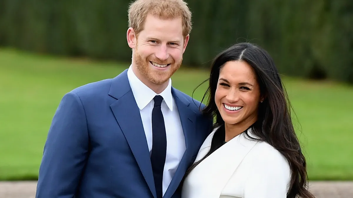 Prince Harry (L) and Meghan Markle