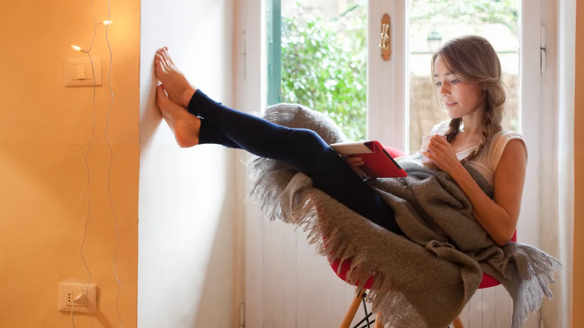 woman in chair with leggings