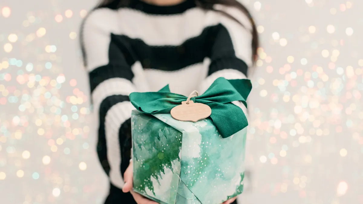 close up hands woman holding a gift box