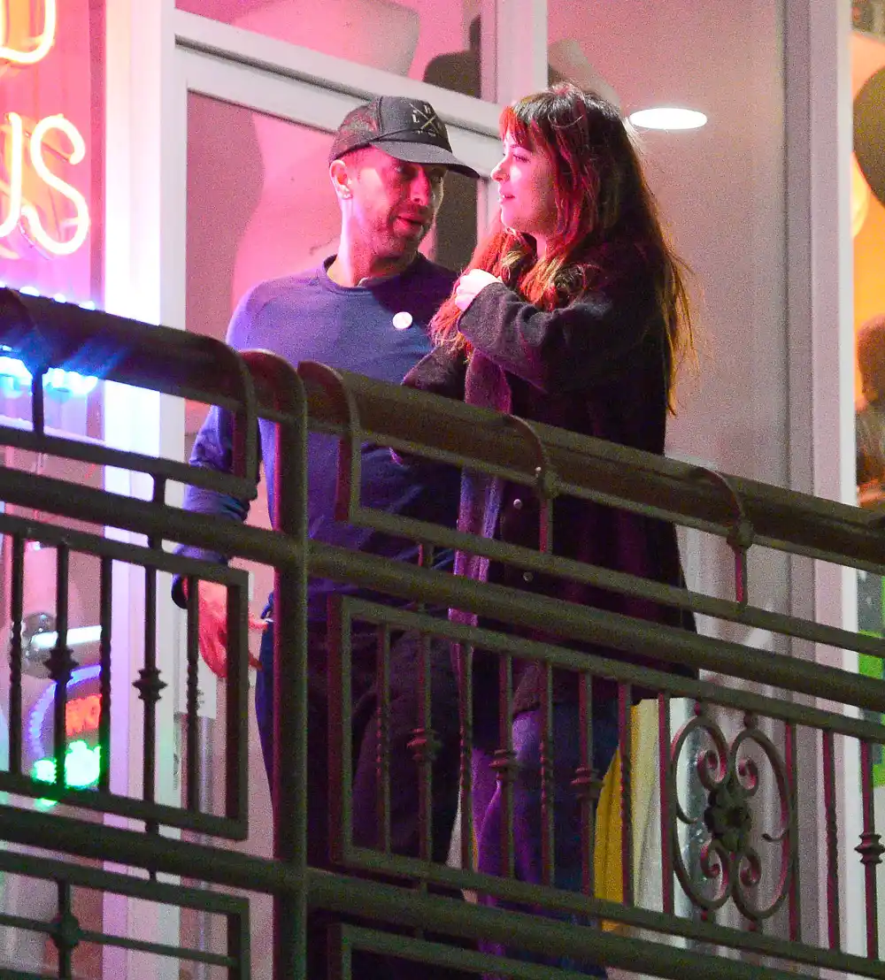 Romantic couple Dakota Johnson & Chris Martin pack on the PDA as they are seen leaving sushi park restaurant where they had their first date earlier this year.