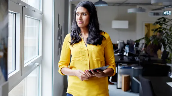 Portrait of a female office worker with tablet
