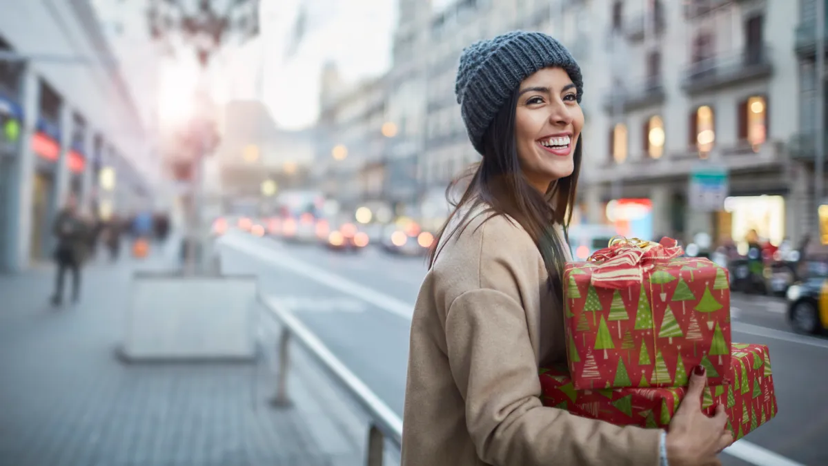 Hailing a taxi after some Christmas shopping.