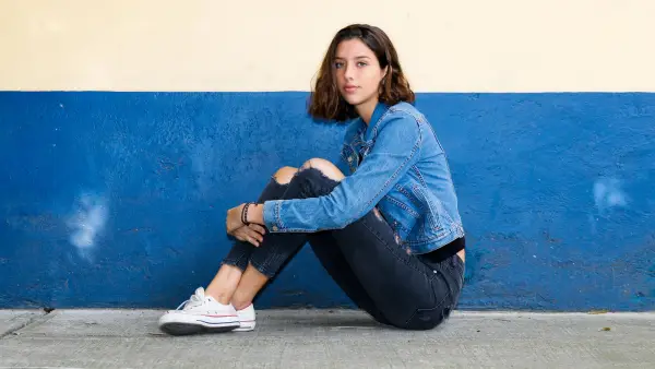 girl in a pair of jeans and a denim jacket