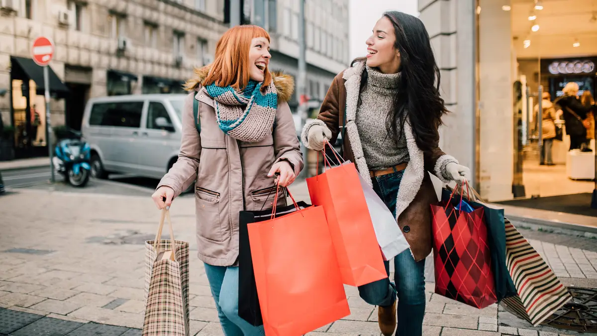 Girls carrying shopping bags