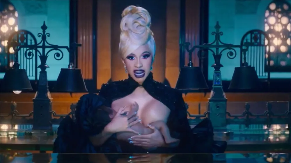 Cardi B Breastfeeds, Plays Piano Naked in New 'Money' Video