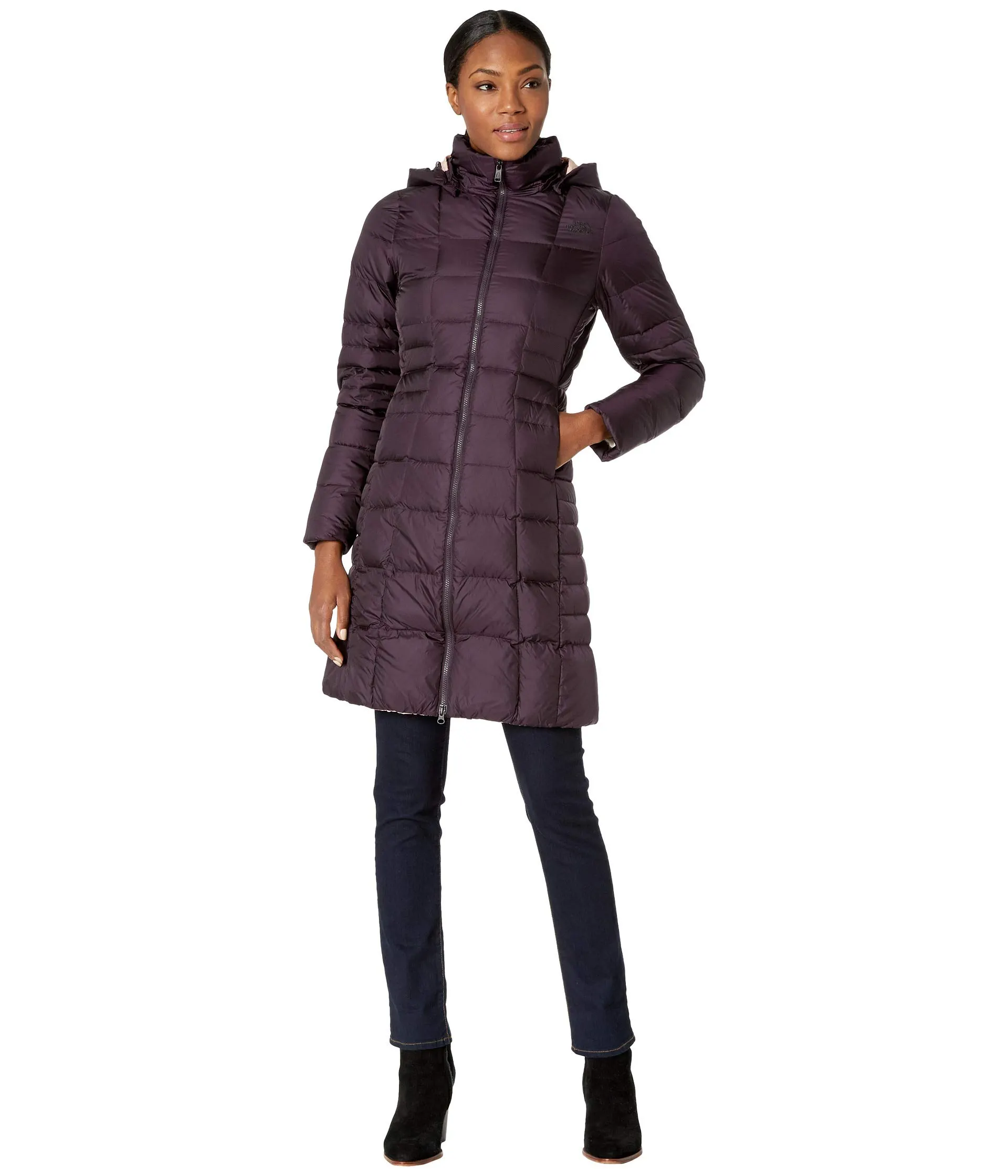 woman wearing a purple north face puffer coat