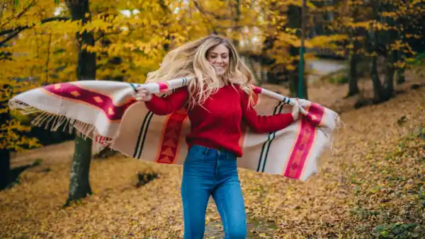 woman with a blanket in jeans