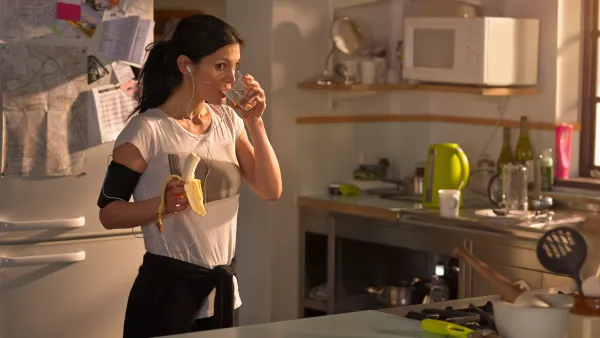 Woman in the kitchen preparing for run