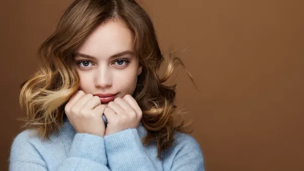 young woman in a blue outfit