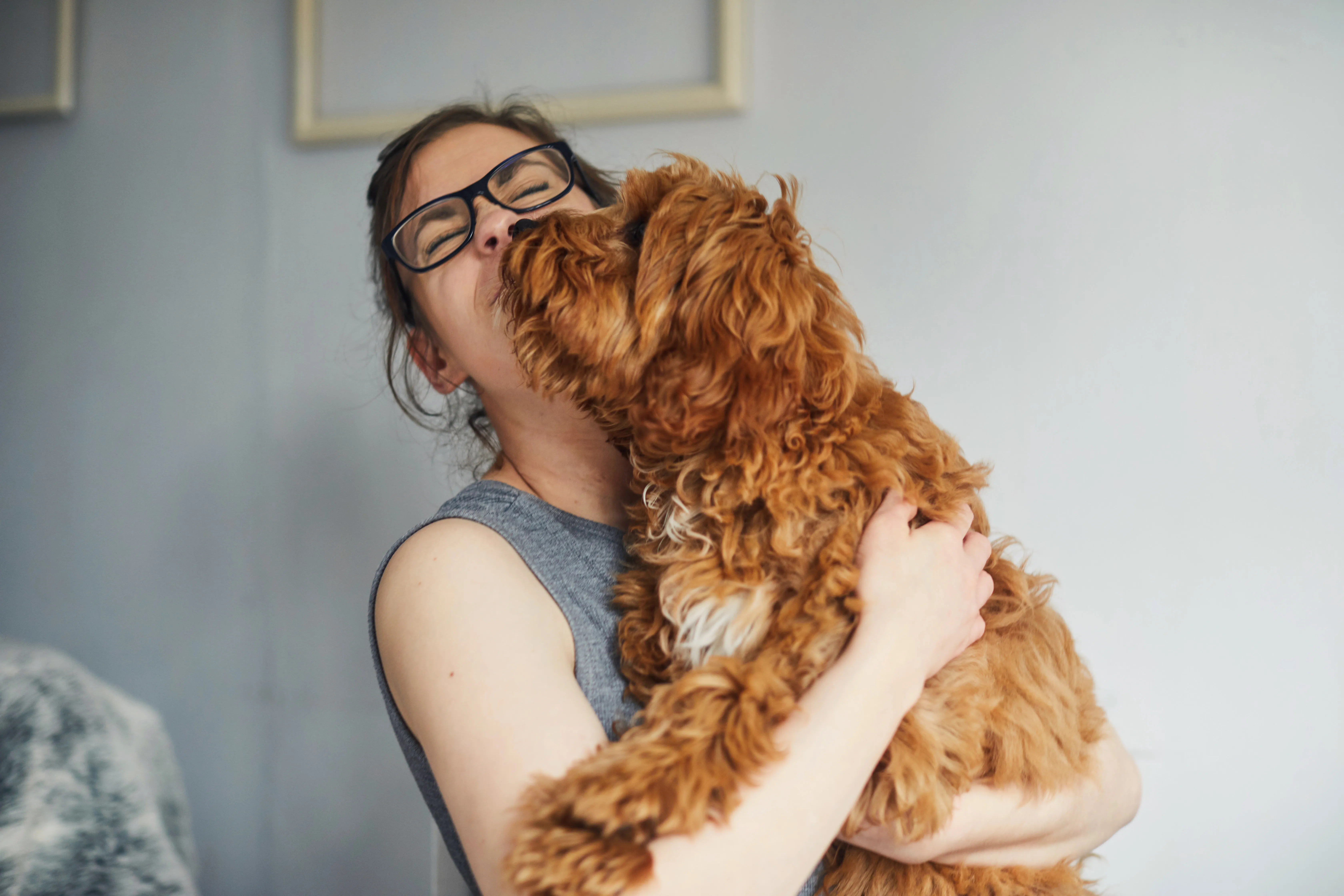woman holding pet dog