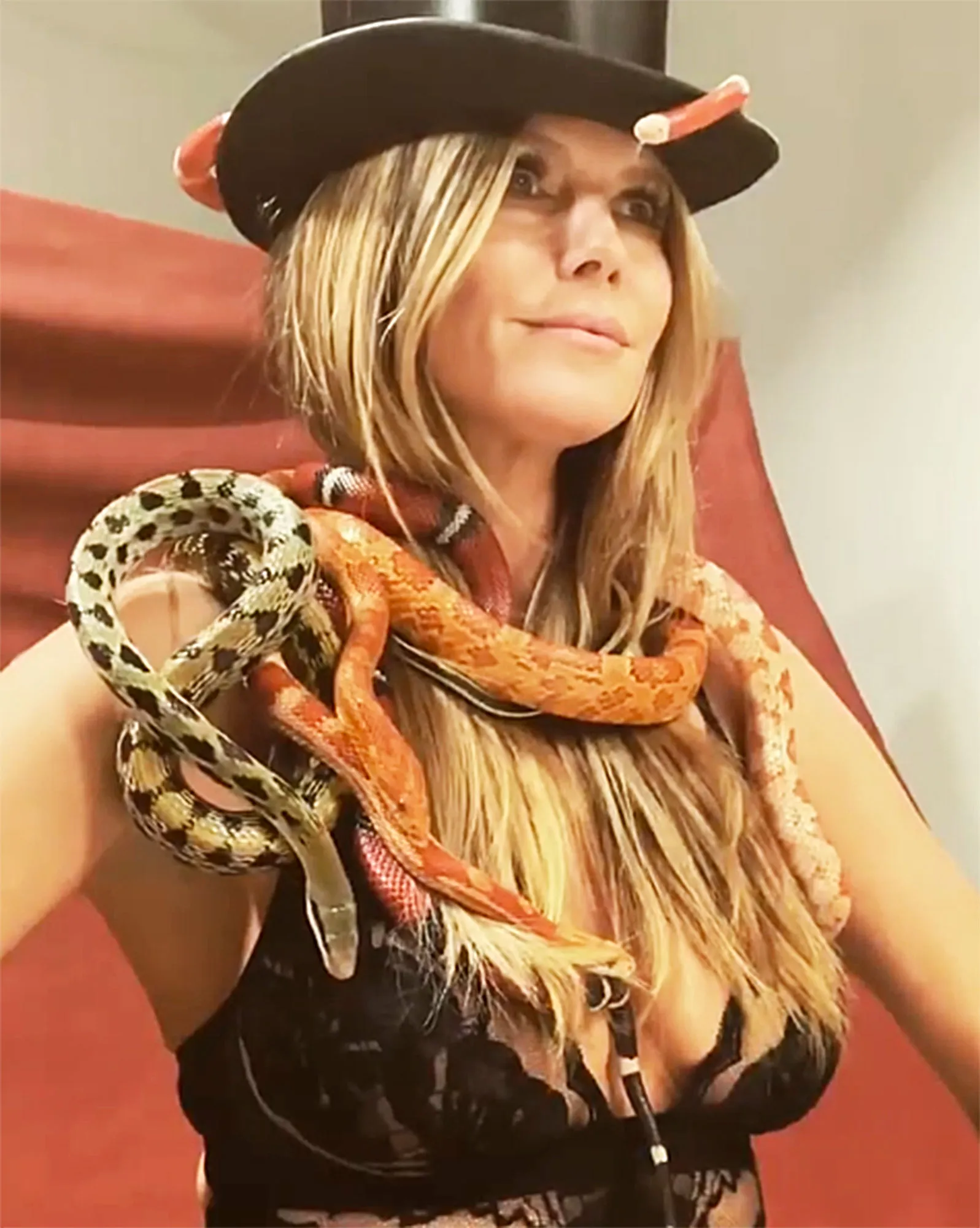 Heidi Klum Poses In Bra While Covered in Snakes