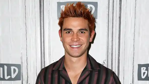 KJ Apa Cuddles Tiny Dog Shirtless