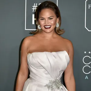 Chrissy Teigen Jokes She Shouldn’t Leave Her ‘Couch Corner’ After John’s Birthday