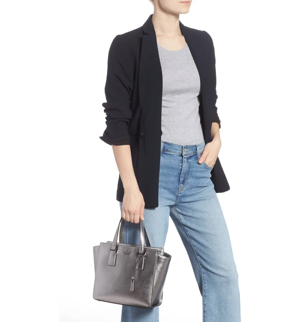 kate spade metallic leather satchel held by a model