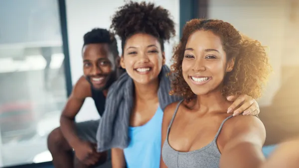 Cropped shot of three young people taking a selfie after yoga class