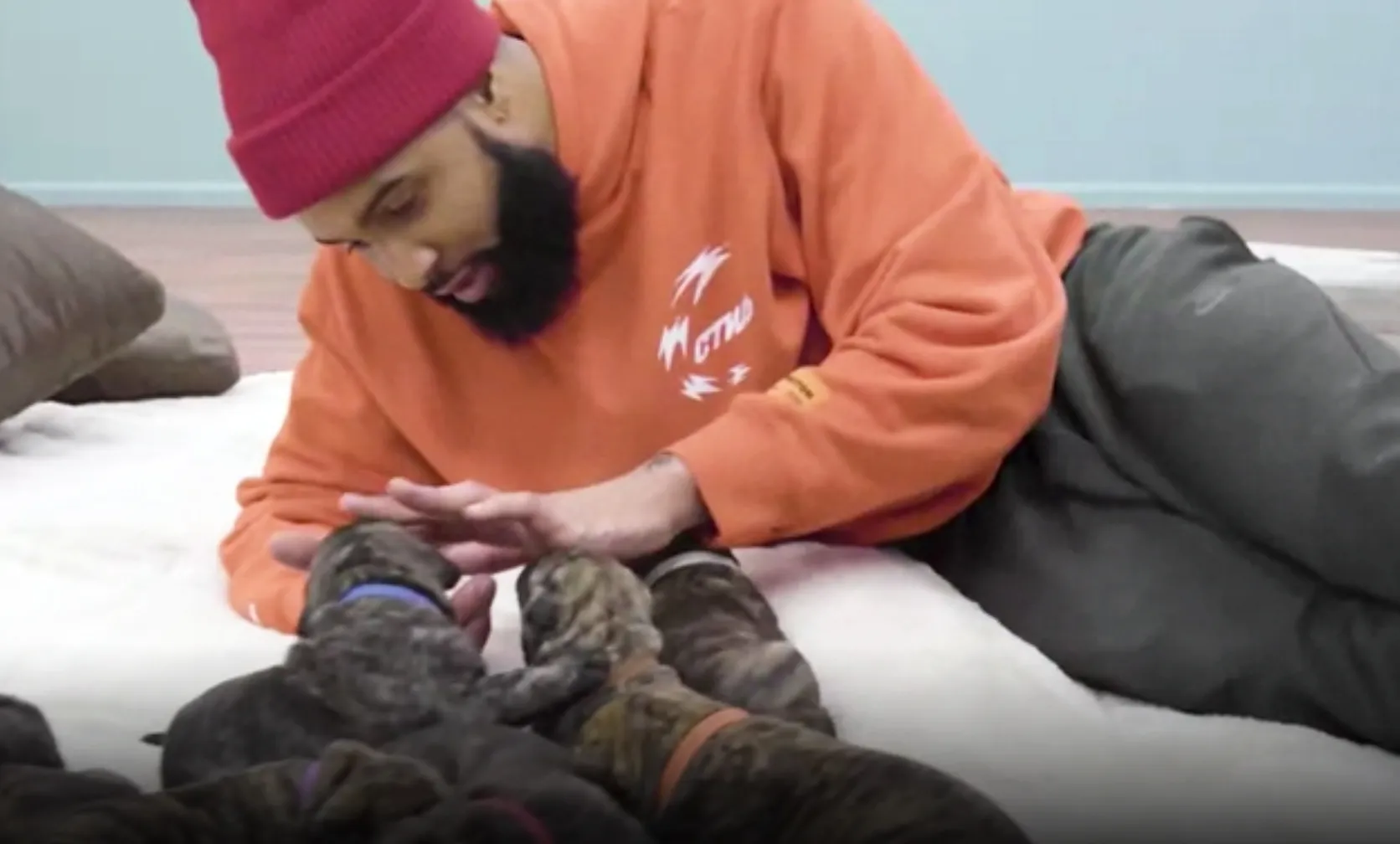 Odell Beckham paying with puppies