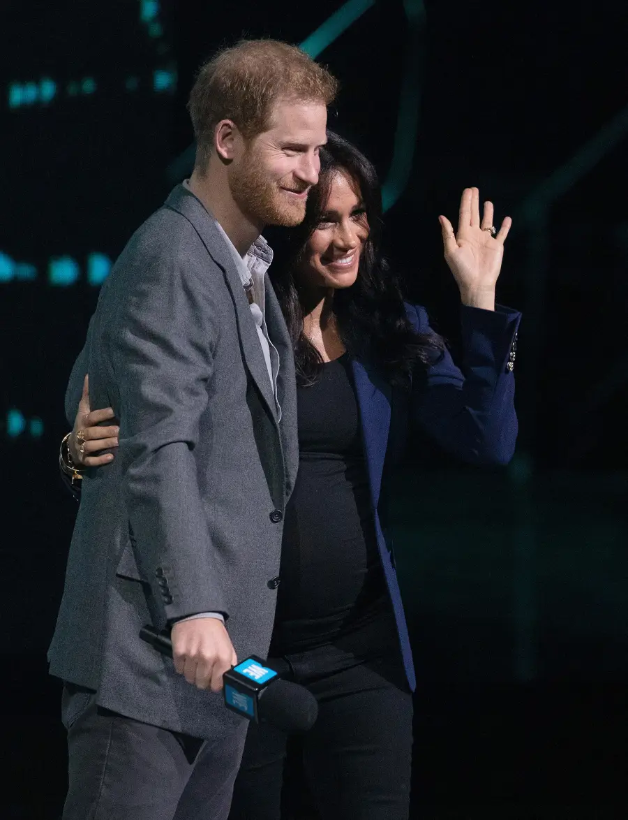 Prince Harry Surprises Crowd and Drags Pregnant Wife Duchess Meghan on Stage at Charity Event
