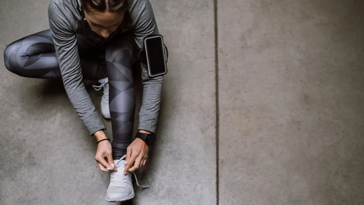 Young athlete jogging in underground garage