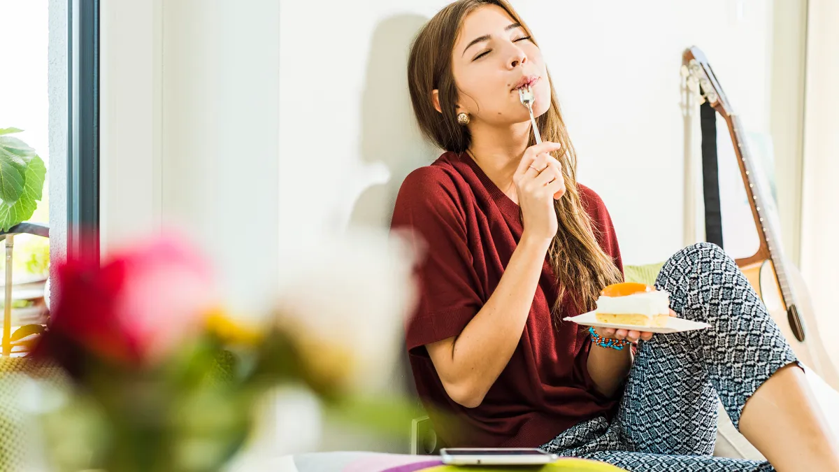 Woman Eating Cake