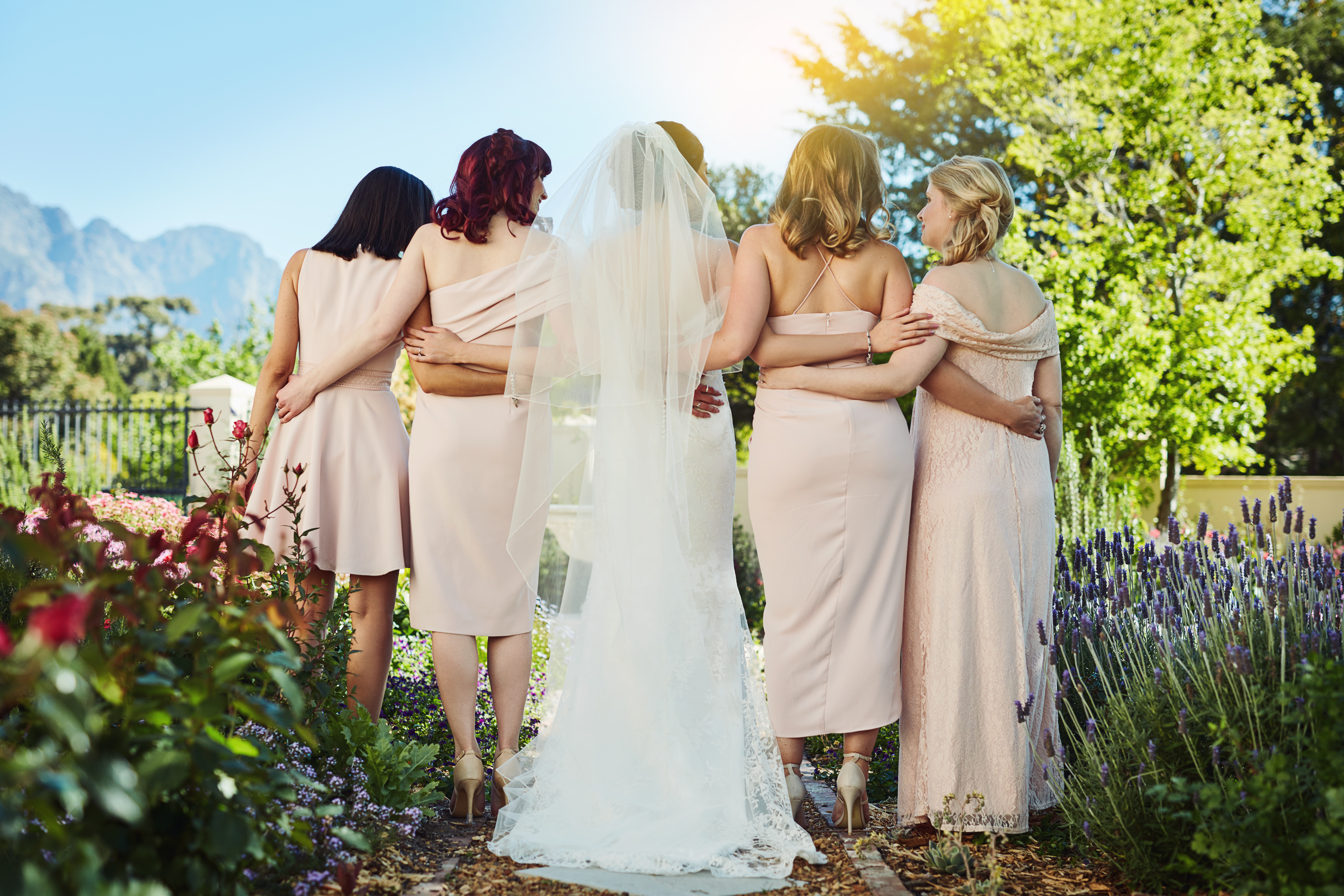 Rearview shot of a young bride and her bride's maids