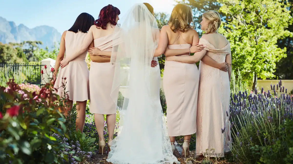 Rearview shot of a young bride and her bride's maids