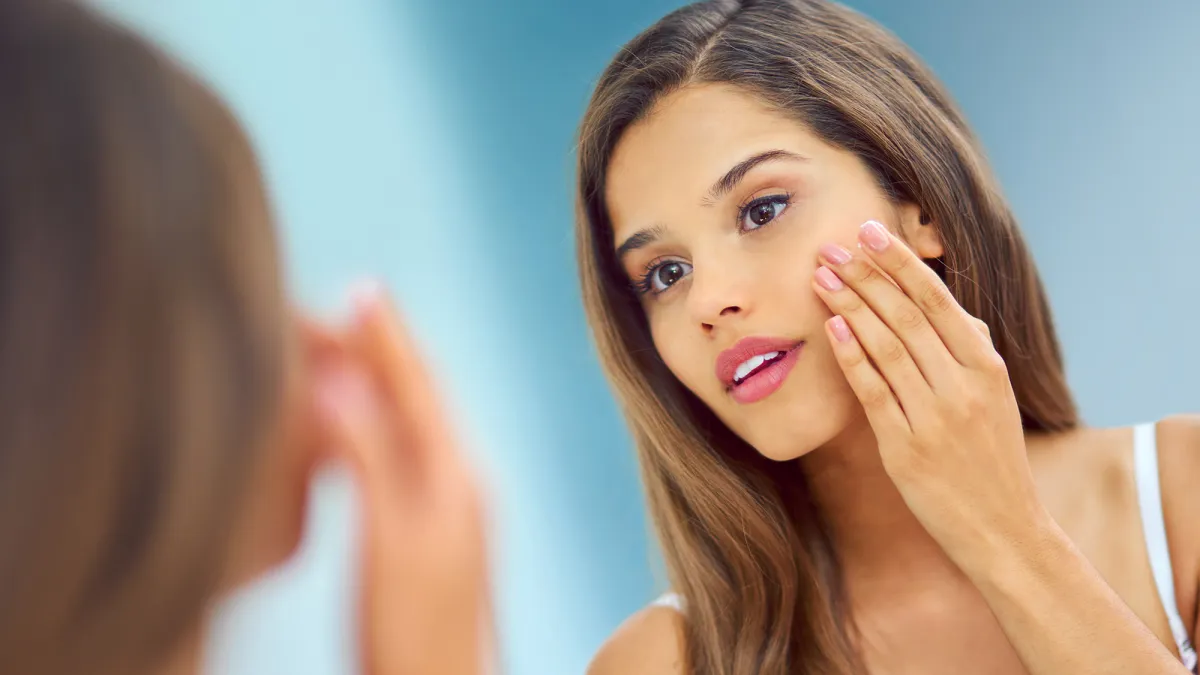 Woman Applying Skincare