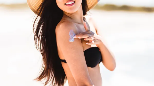 Woman Applying Sunscreen