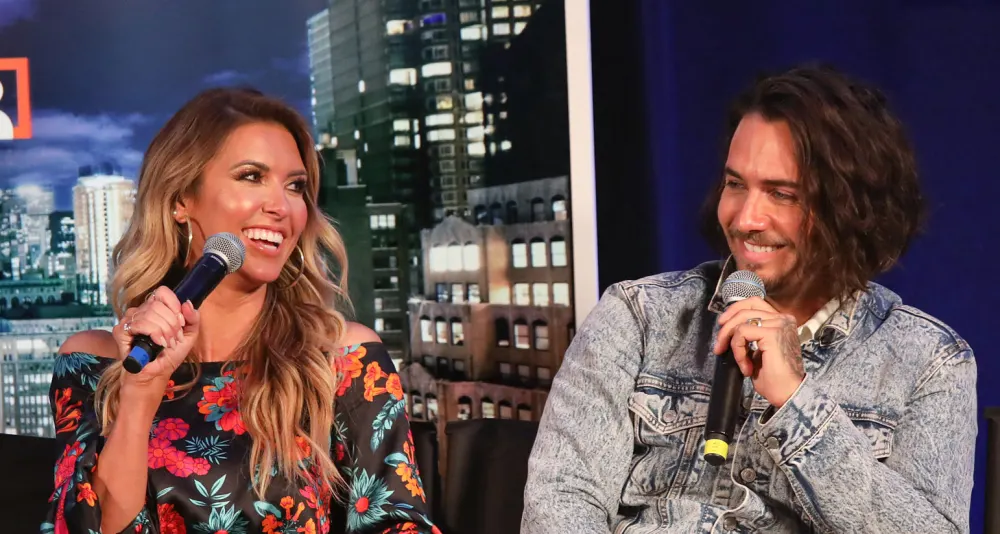 Audrina-Patridge-Flirts-With-Justin-Bobby-Brescia-To-Help-With-Her-Divorce-Interview-Microphone-Smile Flower Dress Denim Jacket