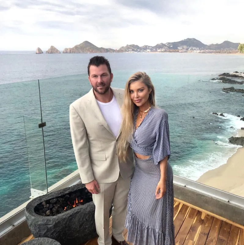 Doug Reinhardt and Mia Irons Overlooking Water Beach Sand Mountains