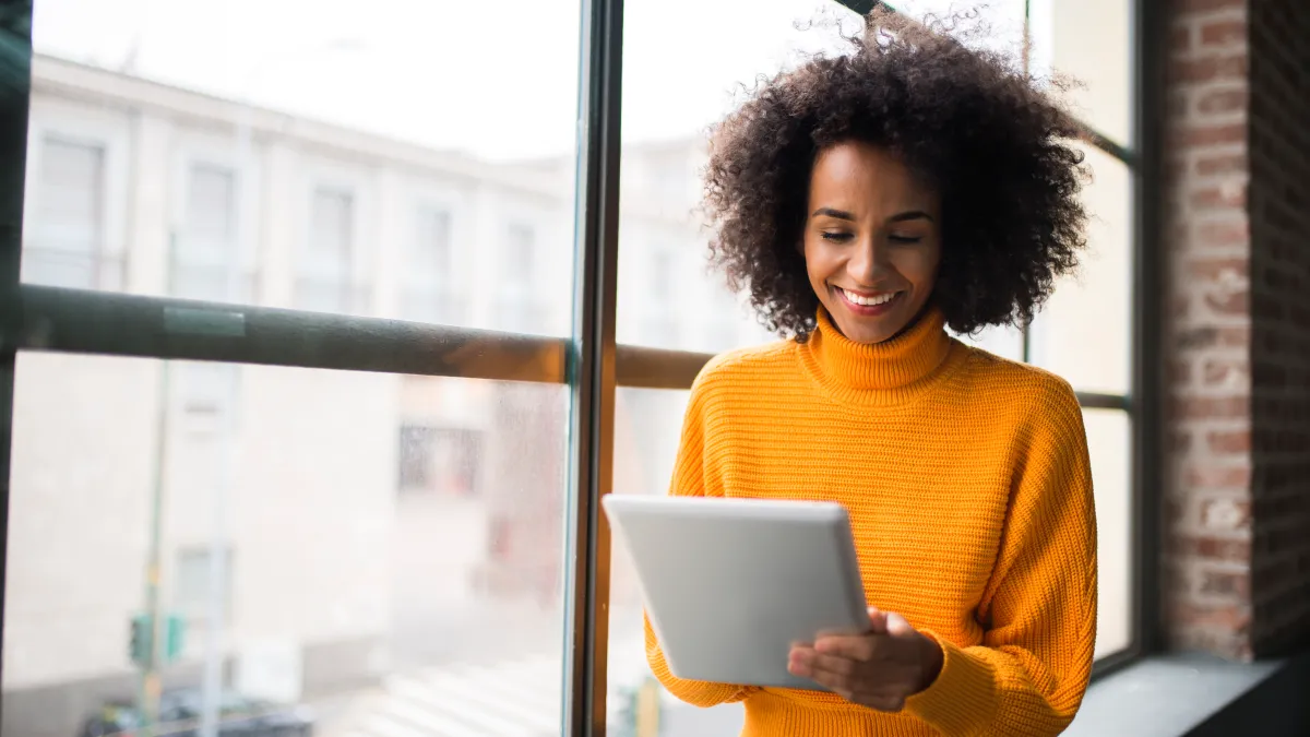 woman using digital tablet