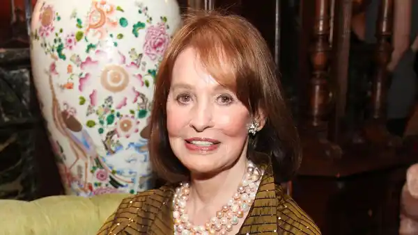 Gloria Vanderbilt Sitting Drinking a Glass of Wine