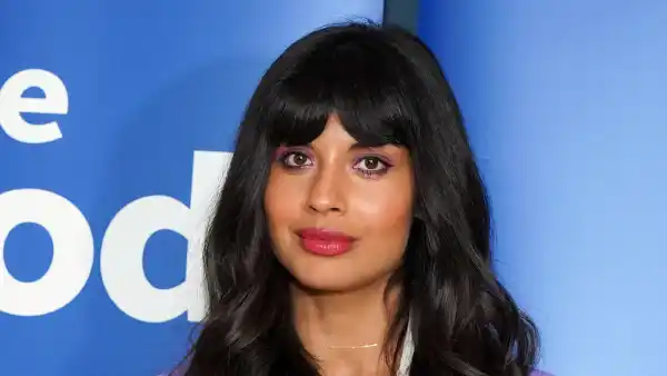 Jameela Jamil Wearing a White Shirt and Purple Jacket and Purple Pants