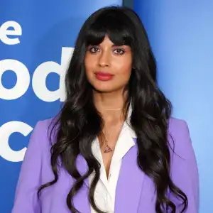 Jameela Jamil Wearing a White Shirt and Purple Jacket and Purple Pants