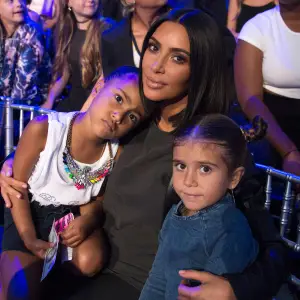 Kim Kardashian cuddles daughter North West and niece Penelope Disick