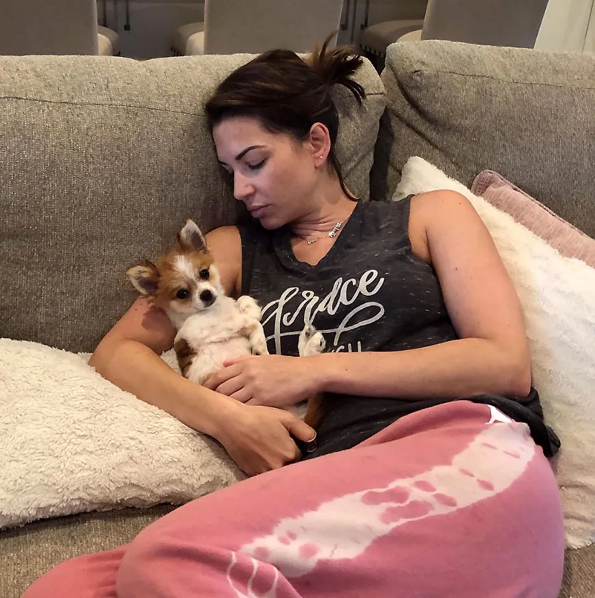 Melissa Rycroft Feeling Sick Wearing Sweat Pants Sitting On Couch Holding Little Dog