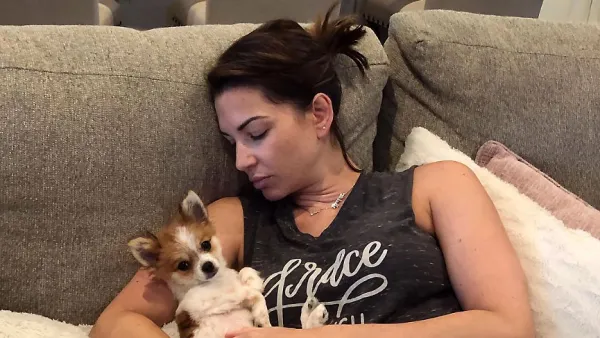Melissa Rycroft Feeling Sick Wearing Sweat Pants Sitting On Couch Holding Little Dog