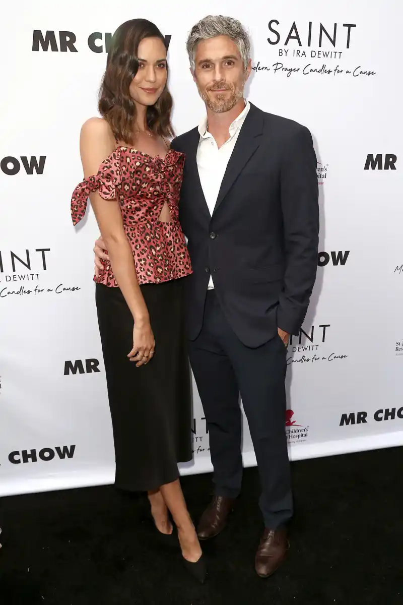 Odette Annable Wearing a Black Skirt and Multi Color Topa nd Dave Annable With White Shirt and Suit