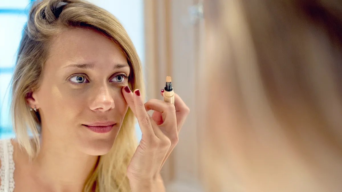 Woman Applying Concealer