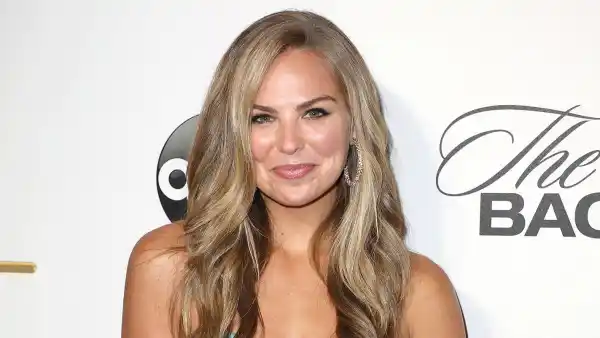 Hannah Brown Wearing A Flower Pattern Dress Stares At Walls