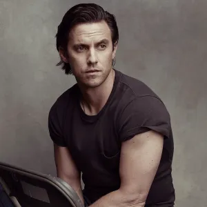 Milo-Ventimiglia-tshirt-chair-arms