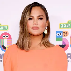 Chrissy Teigen Orange Dress May 29, 2019