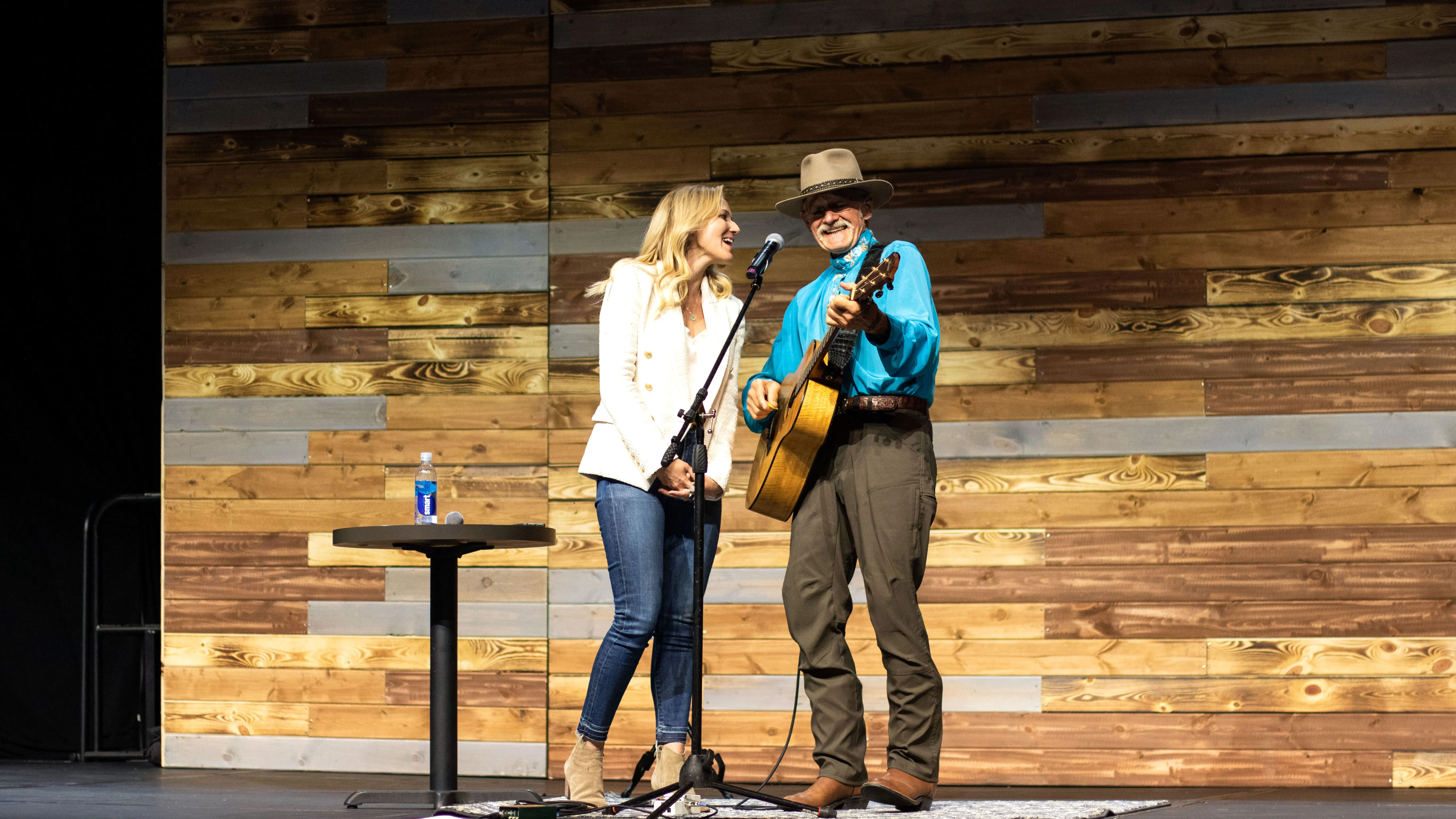 Inside the Denver Wellness Your Way Festival Jewel and her father, Atz Kilcher, performing together on the Johnson & Johnson main stage