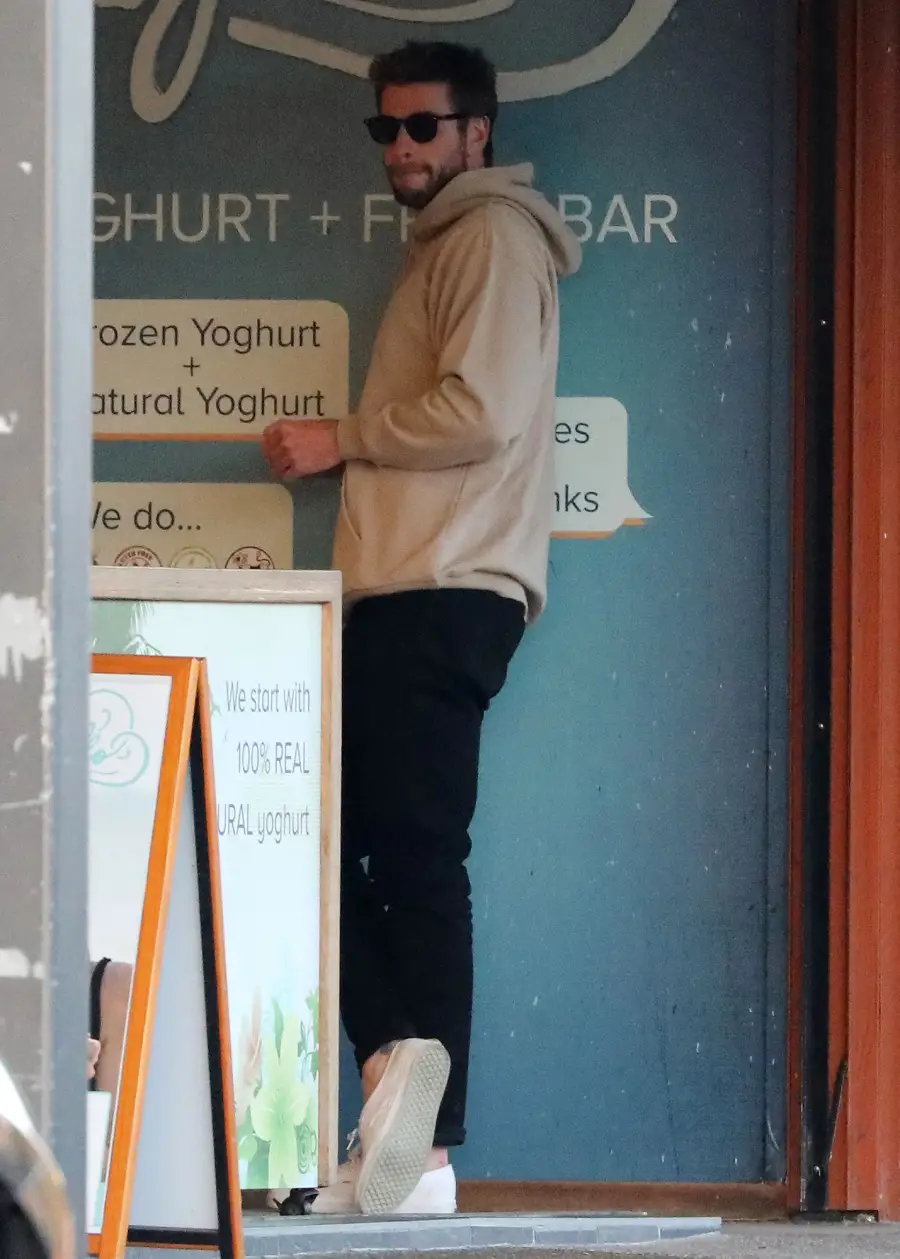 Liam Hemsworth Wearing a Grey Hoodie and Sunglasses Breaks Silence After Miley Cyrus